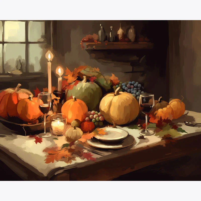 Decorative table setting with pumpkins, candles, and wine glasses in a warm, cozy room.