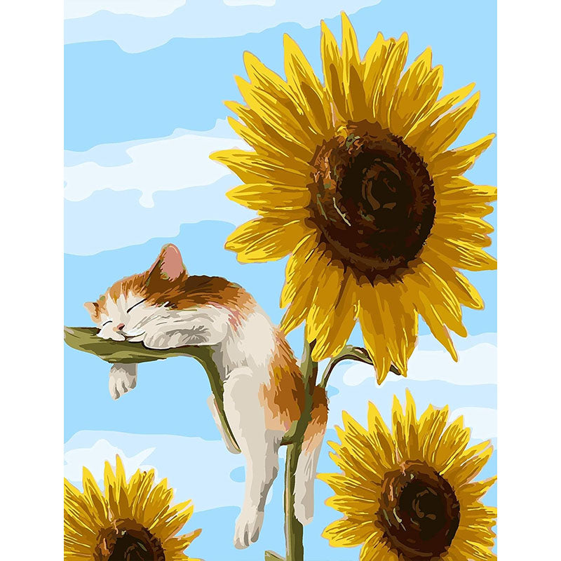Cat sleeping on a sunflower with a blue sky background