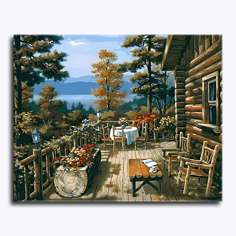 Painting of a wooden cabin deck with chairs and tables, surrounded by trees and a lake.