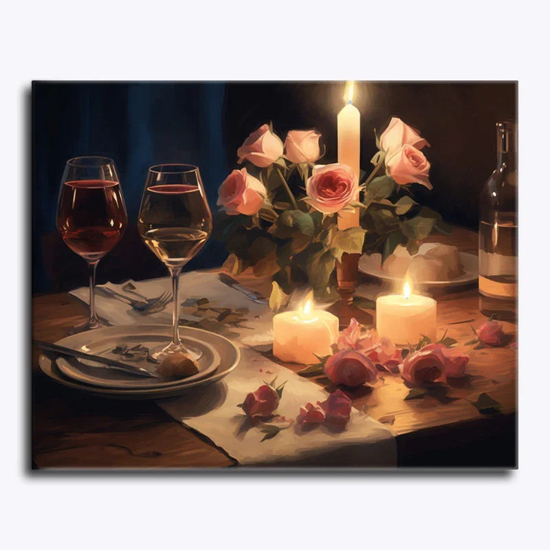 Romantic dinner setup with candles, wine glasses, and flowers on a wooden table.
