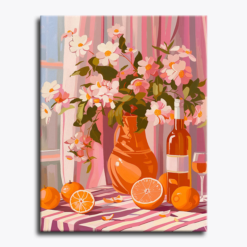 Canvas print of a still life scene with flowers, wine bottles, and oranges on a striped tablecloth.