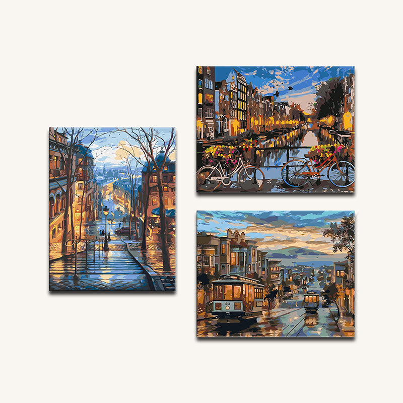 Set of three paintings depicting a cityscape with buildings, a canal, and a tram.