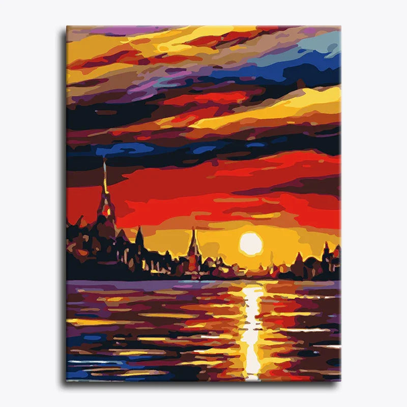 Colorful abstract painting of a sunset over a city silhouette.