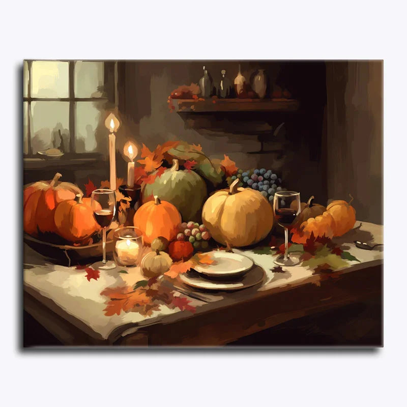 Decorative table setting with pumpkins, candles, and wine glasses on a white tablecloth.