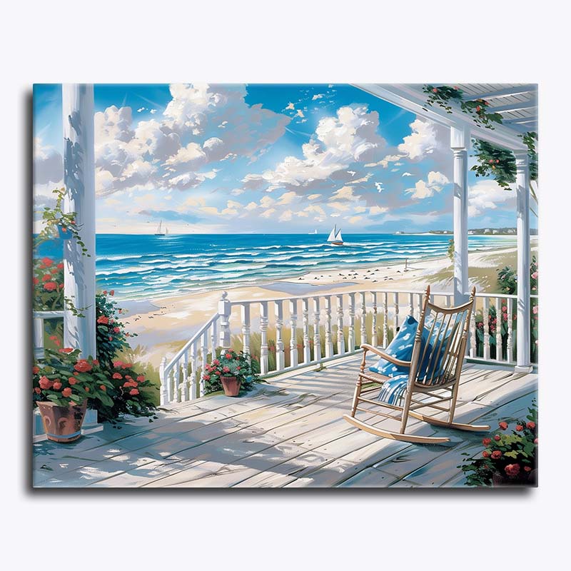 Painting of a beach scene with a rocking chair on a porch.