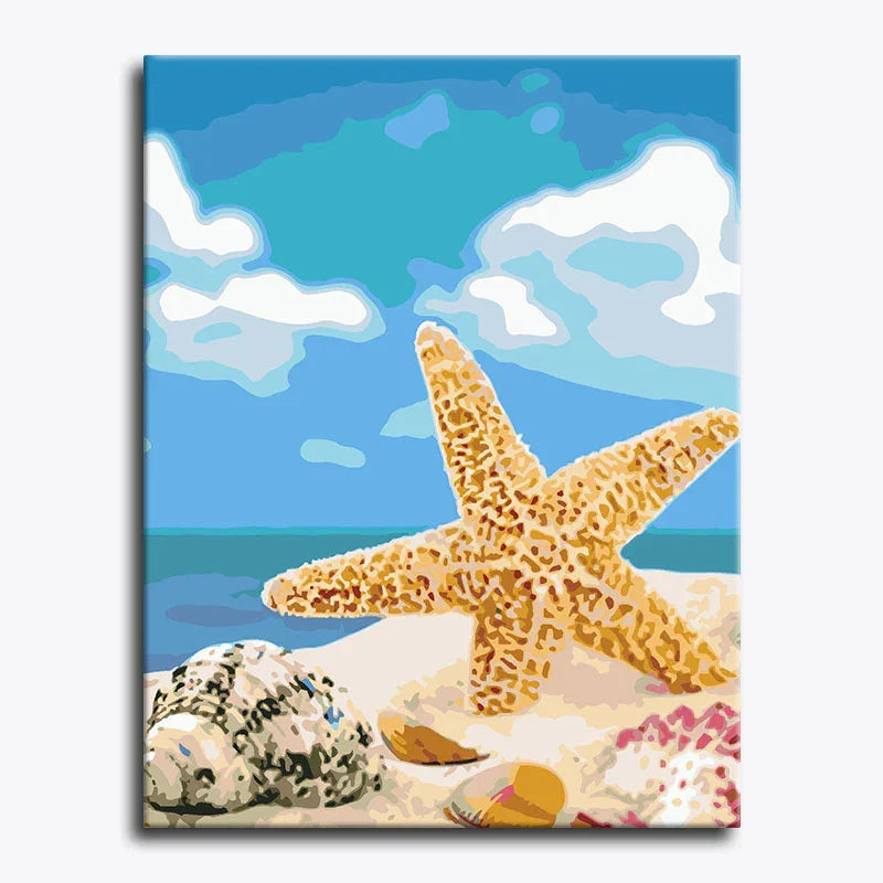 Canvas print with a starfish and shells on a beach background