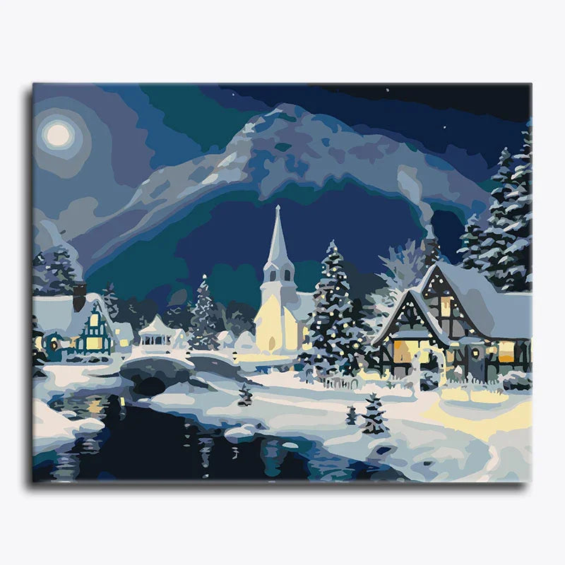 Winter scene with snow-covered village, mountains, and a church steeple.