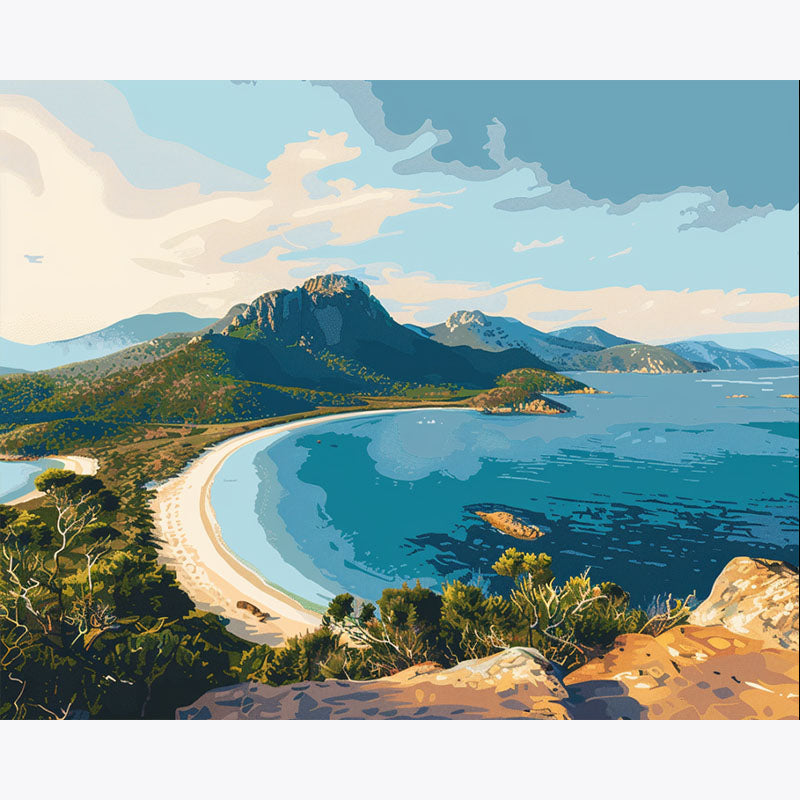 Scenic view of a beach and mountains with clear blue sky.