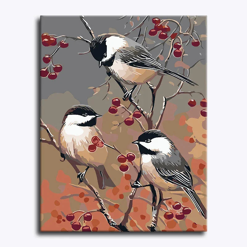 Canvas print with three birds perched on branches with red berries against a multicolored background