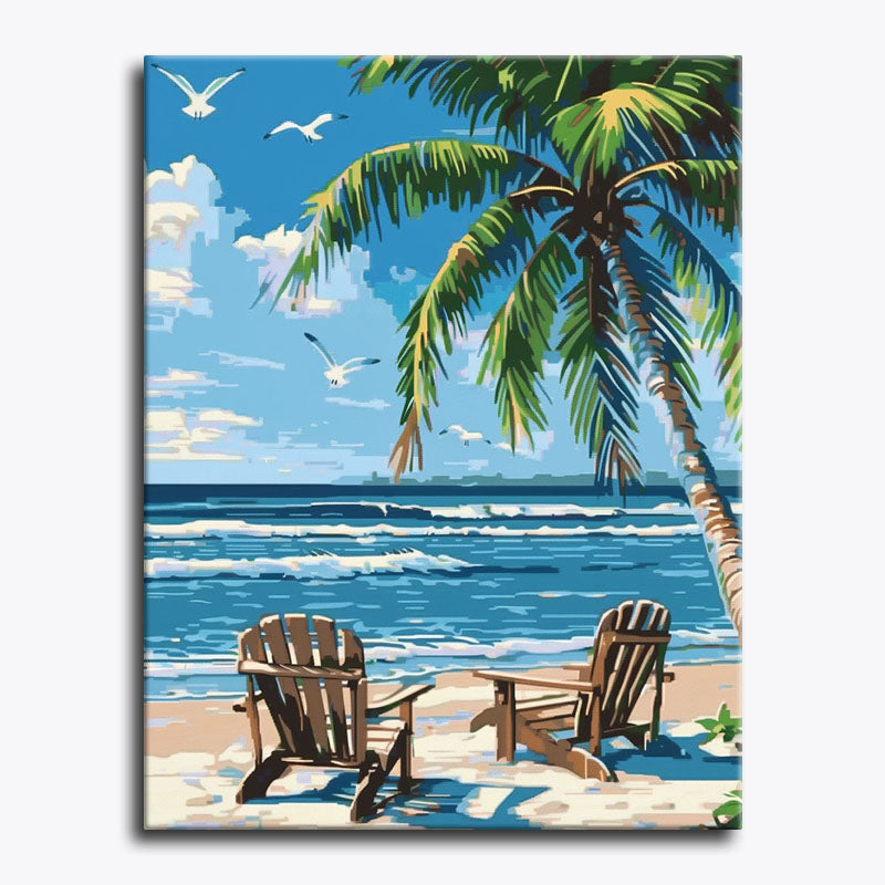 Beach scene with two wooden chairs, palm trees, and a blue sky.