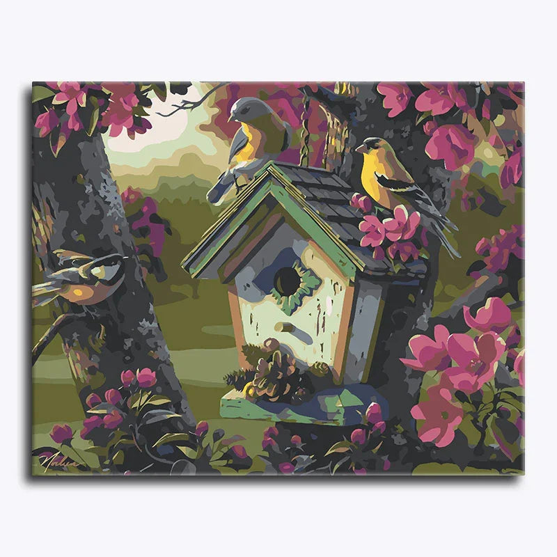 Painting of a birdhouse with birds and flowers on a floral-patterned background