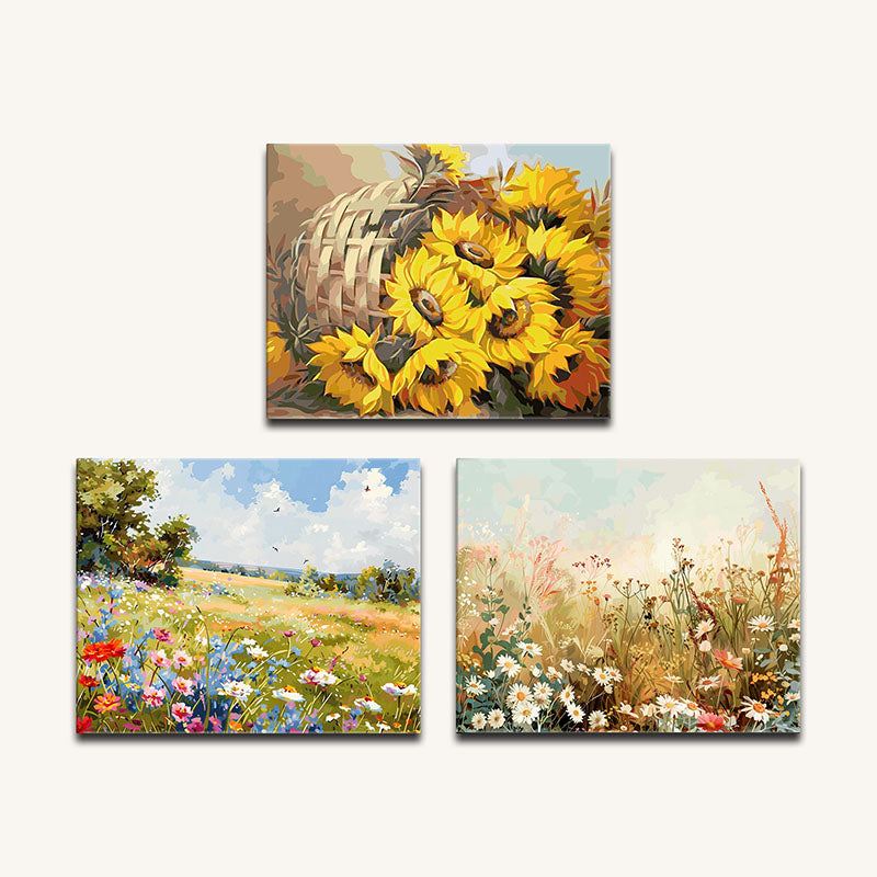 Set of three floral paintings featuring sunflowers, a field with wildflowers, and a basket with flowers.