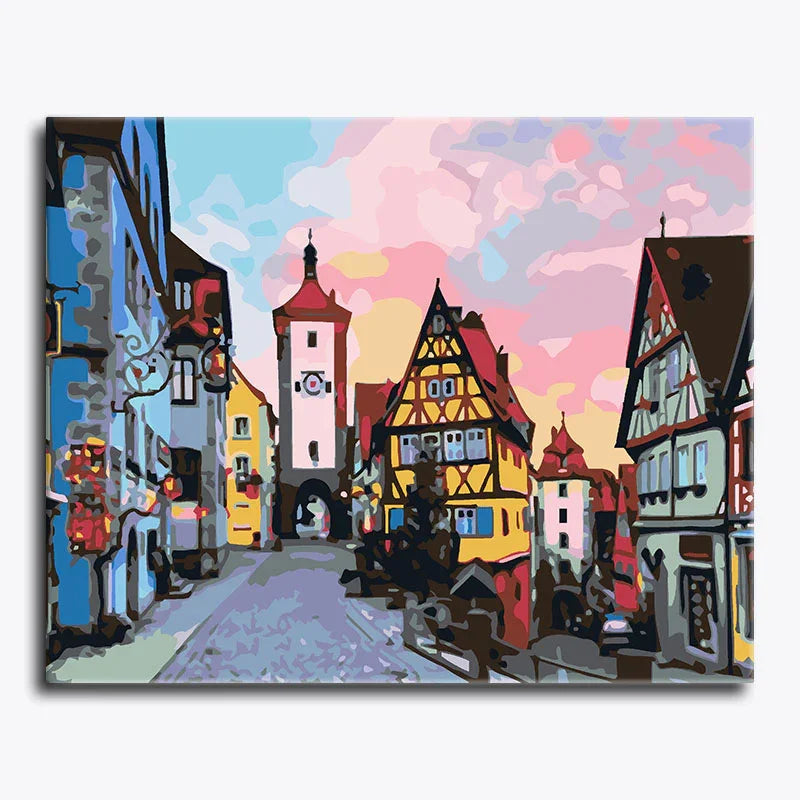 Colorful painting of a European town street with traditional architecture.