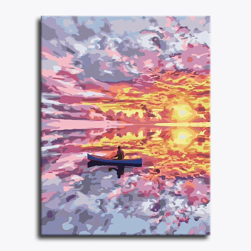 Canvas print of a person in a canoe on a lake with a colorful sunset sky.
