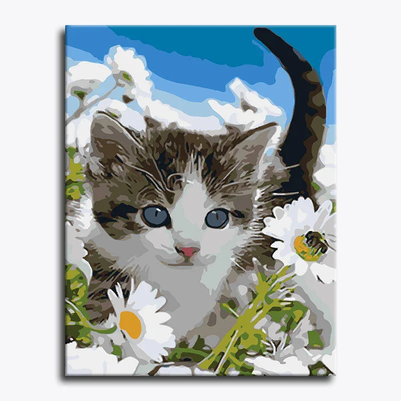 Painting of a kitten among flowers with a blue sky background