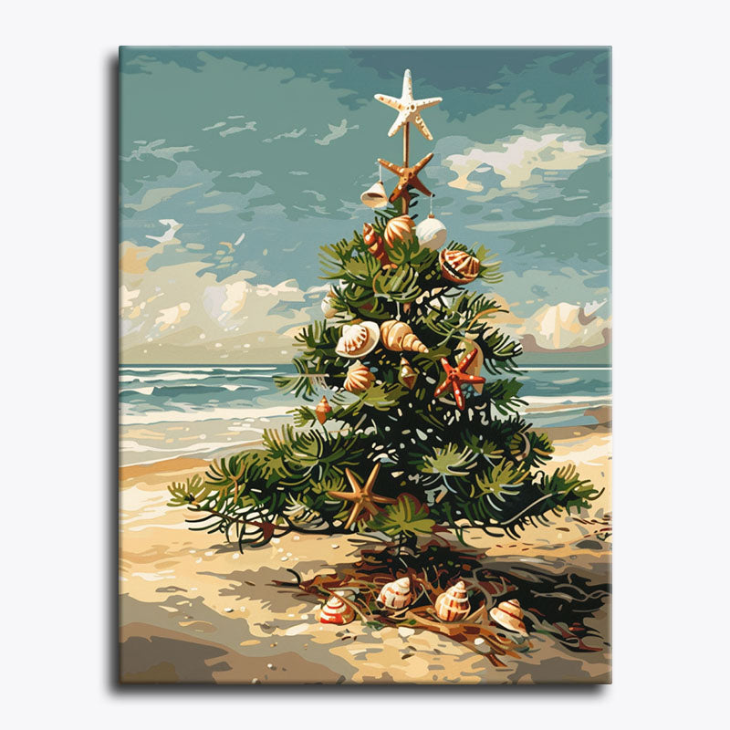 Seashell-decorated Christmas tree on a sunny beach with ocean waves and sky in the background.