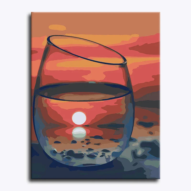Canvas print of a wine glass with a sunset reflection on water.