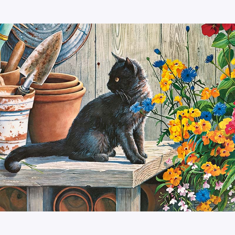 Close-up detail of the black cat’s fur and colourful cottage garden flowers in a paint by numbers artwork.
